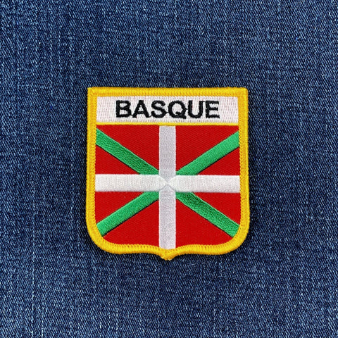 Embroidered patch with Basque flag design on a denim background