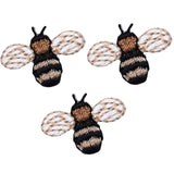 Three embroidered patches depicting bumblebees with black and beige colors on a white background, designed as applique patches.