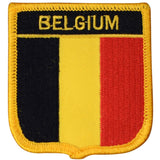 A shield-shaped embroidered patch with the text 'BELGIUM' and the colors of the Belgian flag, designed as a collectible iron on patch.