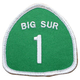 A green embroidered shield-shaped patch with a white border, featuring the white text 'BIG SUR' above a large white number '1'.