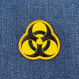 Biohazard symbol patch on denim fabric