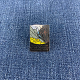 Pin with a design of Black Canyon of the Gunnison National Park on a denim background