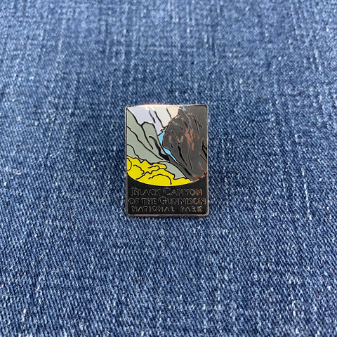 Pin with a design of Black Canyon of the Gunnison National Park on a denim background