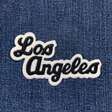 Embroidered 'Los Angeles' patch on denim fabric