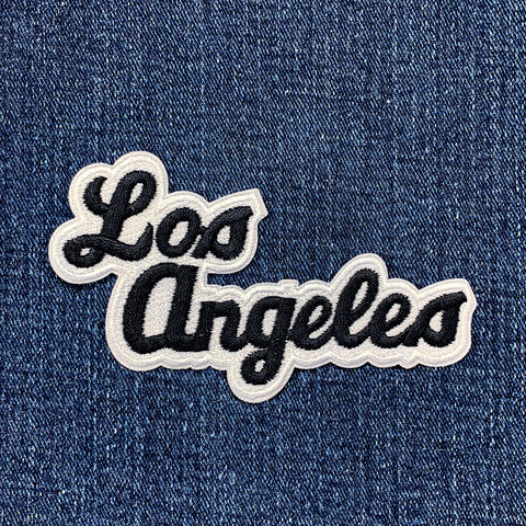 Embroidered 'Los Angeles' patch on denim fabric