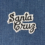 Patch with 'Santa Cruz' text on a denim background