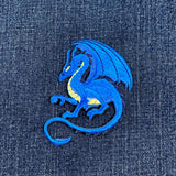 Blue dragon patch on denim fabric