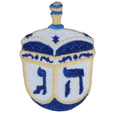Embroidered patch of a blue and white dreidel with star of David and Hebrew letters on a white background