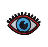 Eye-shaped patch with blue center and black and red outline on a white background
