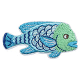 Embroidered patch of a blue and green fish on a white background
