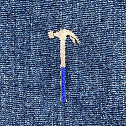 Hammer-shaped patch on a denim background
