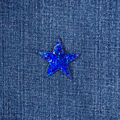 Blue star-shaped sequin patch on denim fabric