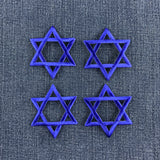 4 blue star of David patches on a denim background
