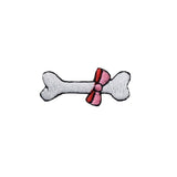 Embroidered patch of a dog bone with a pink bow on a white background
