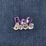 Embroidered patch with ghosts and 'BOO!' text on denim fabric