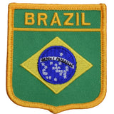 An embroidered patch with a green background and the word 'BRAZIL' in yellow letters at the top. The patch features the Brazilian flag symbol in the center.