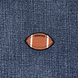 Football patch on a denim background