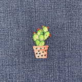 Embroidered cactus patch on denim fabric