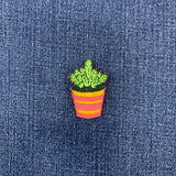 Embroidered potted plant patch on denim fabric