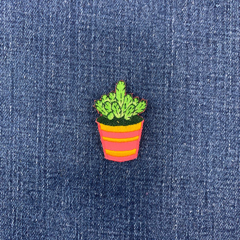 Embroidered potted plant patch on denim fabric