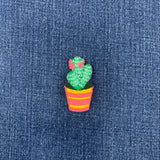 Cactus-shaped patch on a denim background