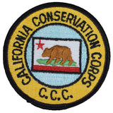 A round vintage patch featuring the California Conservation Corps emblem with a bear and a red star, predominantly yellow, black, and red in color.
