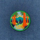 Embroidered patch of California Redwoods on a denim background