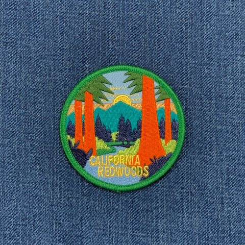 Embroidered patch of California Redwoods on a denim background