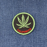 Patch with a cannabis leaf and 'California' text on denim fabric