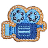 Embroidered patch of a blue camera with orange accents on a white background