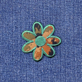 Camo Floral patch on a denim background