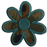 A camouflage patterned daisy applique patch with a green border.
