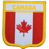 a Canada flag shield shaped patch on a white background