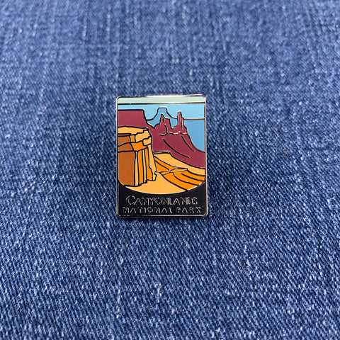 Pin with Canyonlands National Park design on a denim background