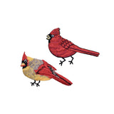 Two embroidered red cardinal patches on a white background