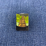Pin with a design of Carlsbad Caverns National Park on a denim background