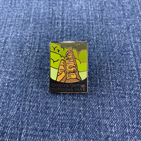 Pin with a design of Carlsbad Caverns National Park on a denim background