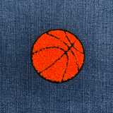 chenille basketball patch on a blue denim background