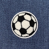 Soccer ball patch on a denim background