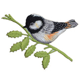 An embroidered patch depicting a chickadee bird on a branch, with a green leafy background and black, orange, and gray details.