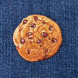 a cookie patch on a denim background