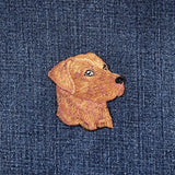 Embroidered dog patch on denim fabric