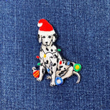 Embroidered patch of a Dalmatian dog wearing a Santa hat on denim fabric.