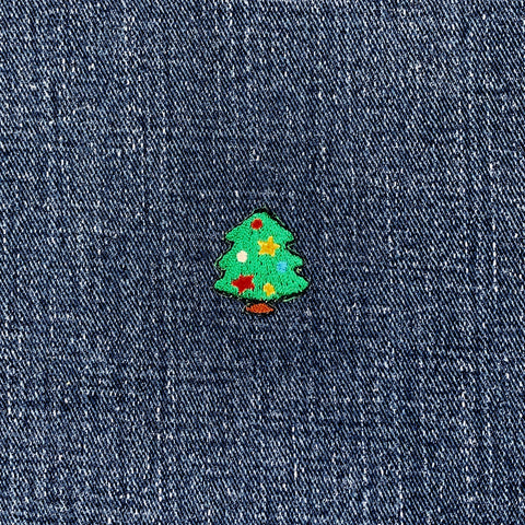 Colorful Christmas tree patch on denim fabric