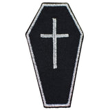 A coffin-shaped embroidered patch with a black background and a silver cross in the center, outlined with a silver border.