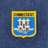 Connecticut state emblem patch on a blue denim background