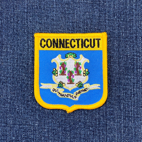 Connecticut state emblem patch on a blue denim background