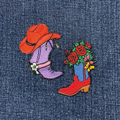 2 embroidered patches on denim fabric featuring a cowboy hat, purple boot, and a red and blue boot with flowers.