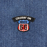 Patch on denim fabric with 'Cruisin' on Route 66' text