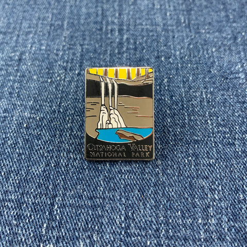 Enamel pin of Cuyahoga Valley National Park on a denim background